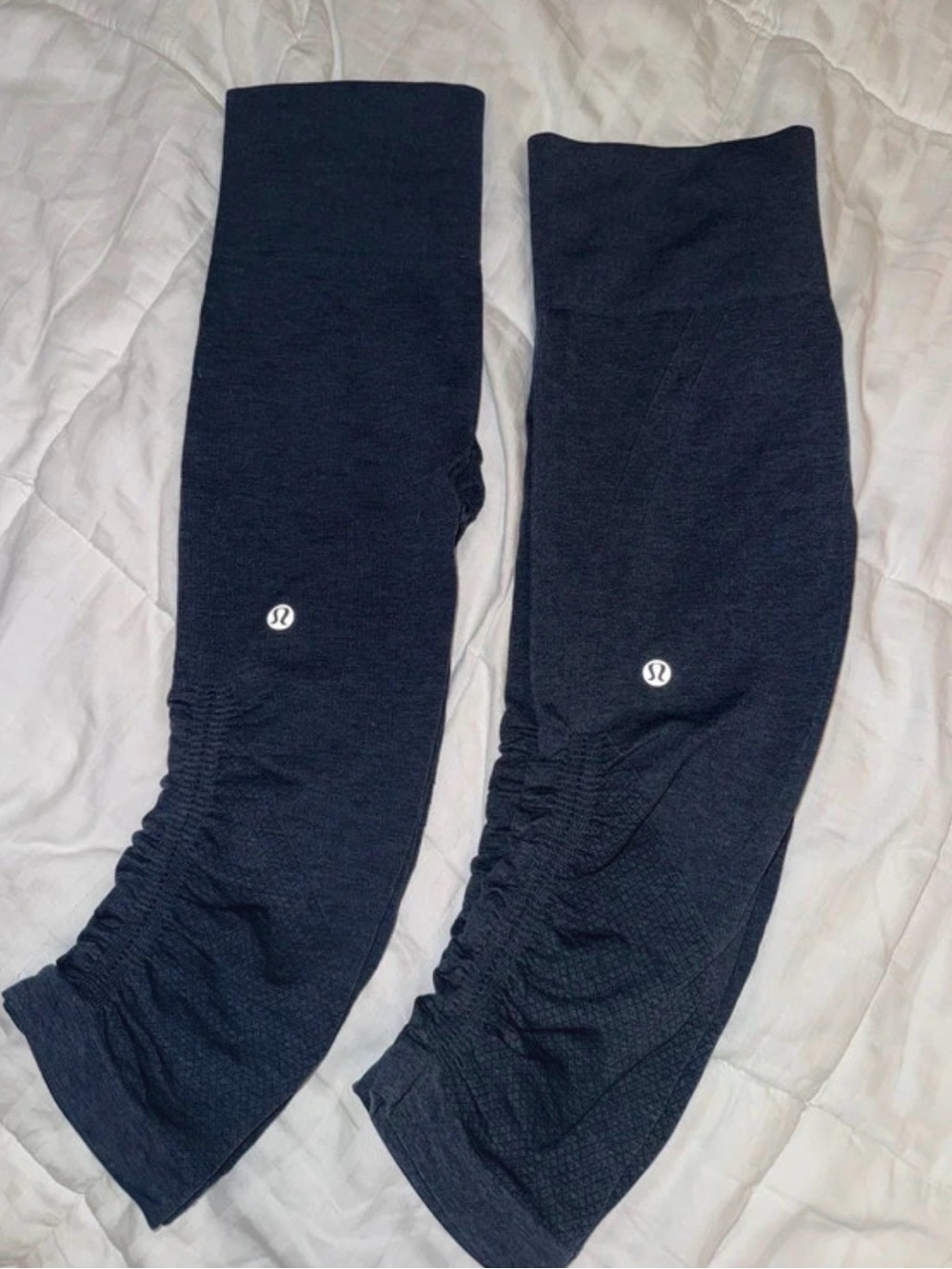2 pairs of lululemon “women in the flow” capri leggings